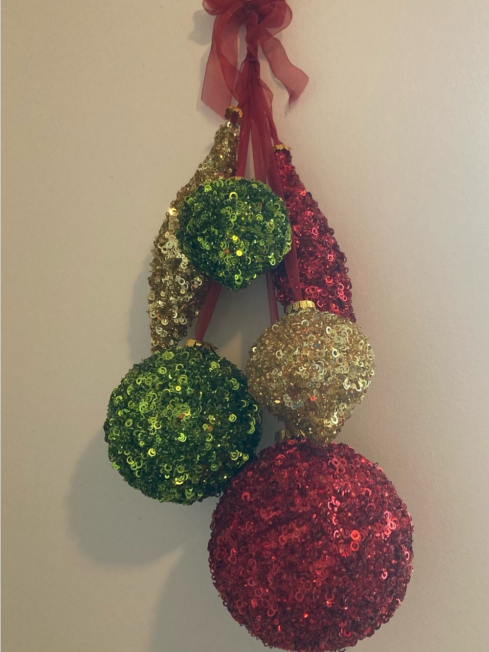 Christmas Hanging With 6 Different shapes of Sequin covered balls on a ribbon.